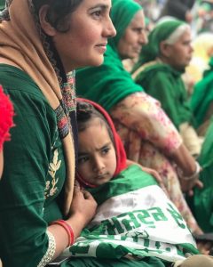 Farmer Mother wrap daughter in flag